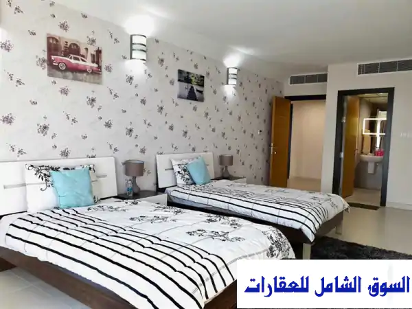 تملك رفاهيتك! 🏡 شقة فاخرة مفروشة 140م للبيع بأبراج تلال - جزر أمواج | إطلالة بحرية وتمويل عقاري متاح