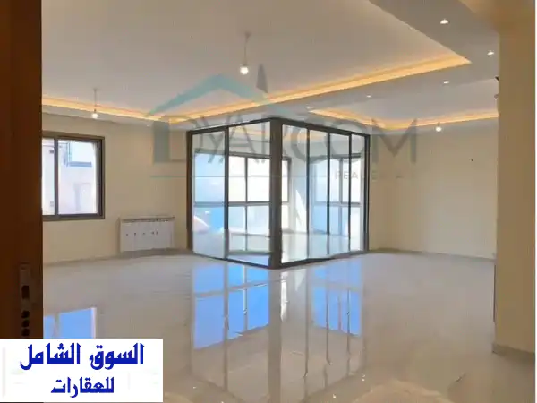 شقة فاخرة للبيع في عين عار - إطلالة بحرية خلابة و...