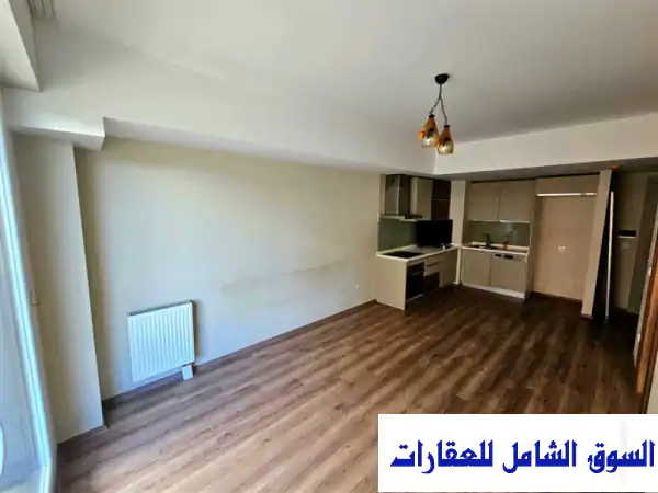 فرصة ذهبية: شقة 1+1 عصرية للبيع في مجمع راديوس الجديد بقلب اسنيورت، إسطنبول | بجوار بلدية وجامعة أسنيورت