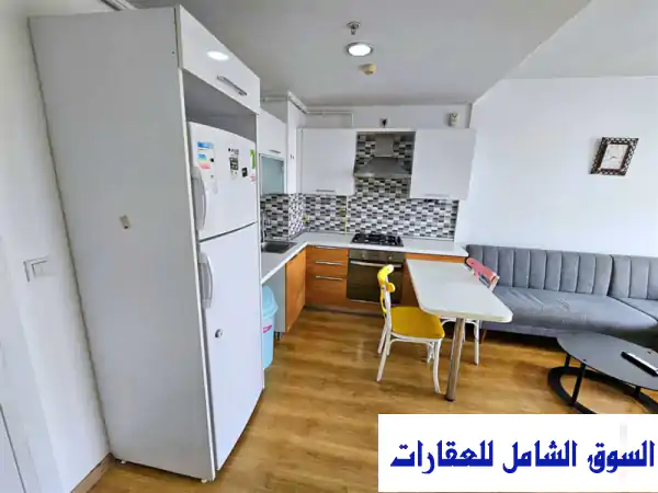 شقة 1+1 مفروشة فاخرة ومكيفة للإيجار السنوي في Innovia 3 أسنيورت، إسطنبول - إطلالة ساحرة ورفاهية متكاملة!
