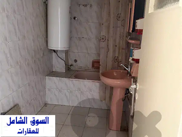 شقة للايجار بفرن الشباك | غير مفروشة، غرفة نوم وصالون | كهرباء 24/7