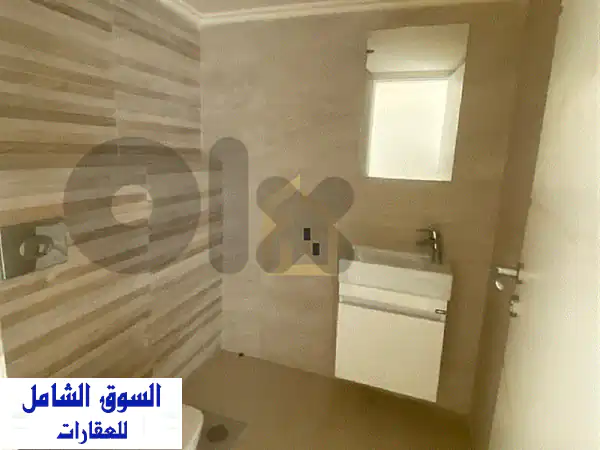 شقة أحلامك للبيع في نيو سهيلة | إطلالة بحرية جبلية خلابة + حديقة وتراس 170م²