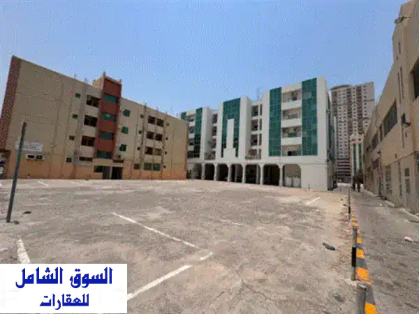 فرصة استثمارية نادرة بالشارقة: أرض سكنية تجارية استراتيجية بأبو شغارة وتصريح بناء استثنائي!