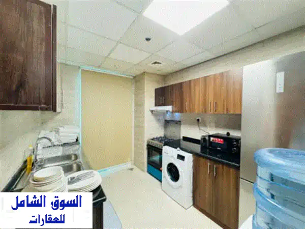 فرصة ذهبية! شقة استثمارية فاخرة للبيع في برج الواحة 2 عجمان - عائد 11% وإطلالة مائية ساحرة