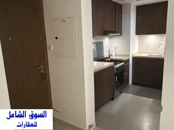 تملك حر: شقة فاخرة غرفة وصالة للبيع بكمبوند الزاهية أب تاون الشارقة | استثمار وسكن الأحلام