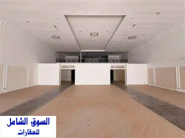 فرصة استثنائية: معرض ضخم 15000 قدم للإيجار السنوي بالصناعية 4 | موقع حيوي وتشطيبات فاخرة