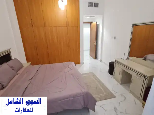إيجار شهري عجمان: شقة غرفتين وصالة فاخرة ببرج الواحة | الراشدية 1 | شامل الفواتير والإنترنت + إطلالة بحرية!