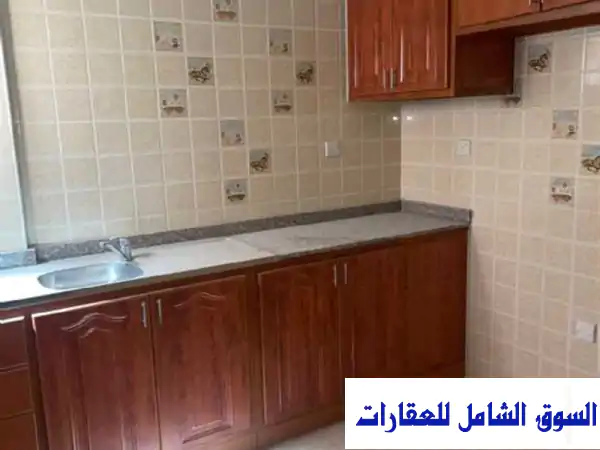 فرصة ذهبية! شهر مجاني على إيجار شقة نظامية 2 غرف نوم في معيذر التجاري بالريان | قرب جميع الخدمات الحيوية