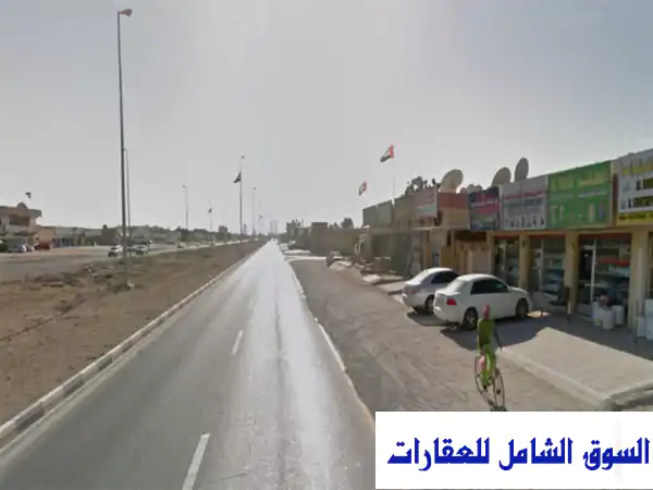 فرصة استثمارية ذهبية: محلات وعقار سكني تجاري بدخل 100,000 درهم سنويًا في جلفار، رأس الخيمة | تملك حر وموقع استراتيجي