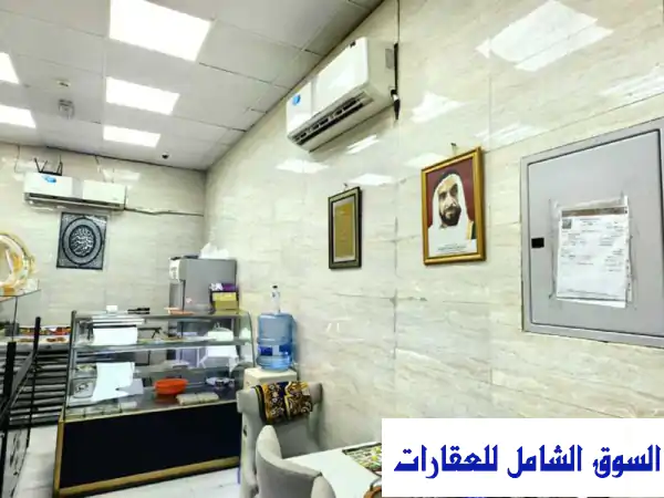 فرصة استثمارية ذهبية: محل تجاري للبيع على شارع الشيخ عمار الرئيسي، الروضة 2 عجمان - جاهز وشغال بمساحة 283م²