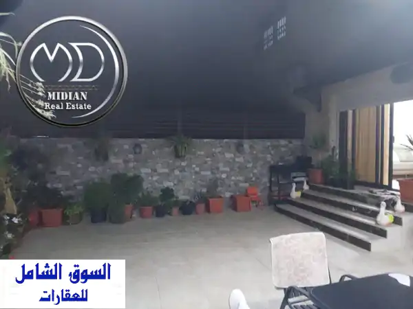 شقة أرضية فخمة للبيع في حي الصحابة 205م بتراس وحديقة...