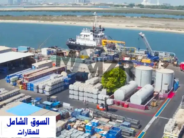 أرض صناعية للبيع بالمصفح، أبوظبي | عائد استثماري 12% | 7 محلات وستورات | LI 25693