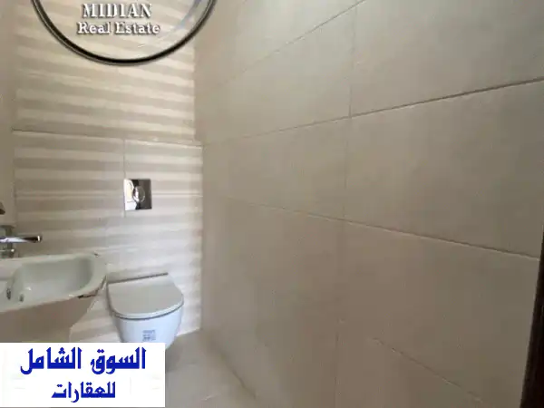 شقة شبه أرضي فاخرة للبيع في تلاع العلي - مساحة 310م² + حديقة خاصة!