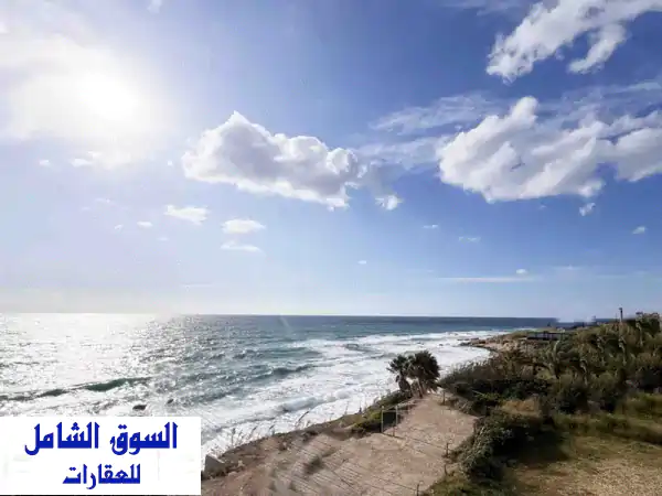 شاليه فاخر للبيع في عمشيت بإطلالة بحرية خلابة -...
