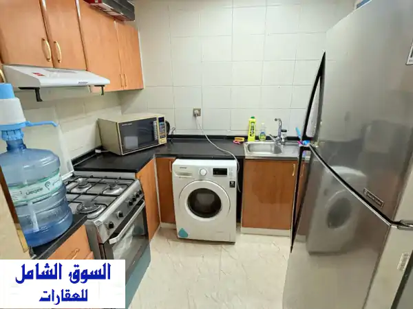 شقة مفروشة للبيع في أبراج الخور الراشدية 1 بعجمان - فرصة استثمارية مميزة!
