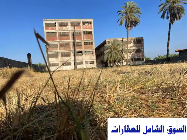 فرصة استثمارية مميزة: أرض فضاء ومبانٍ متكاملة...