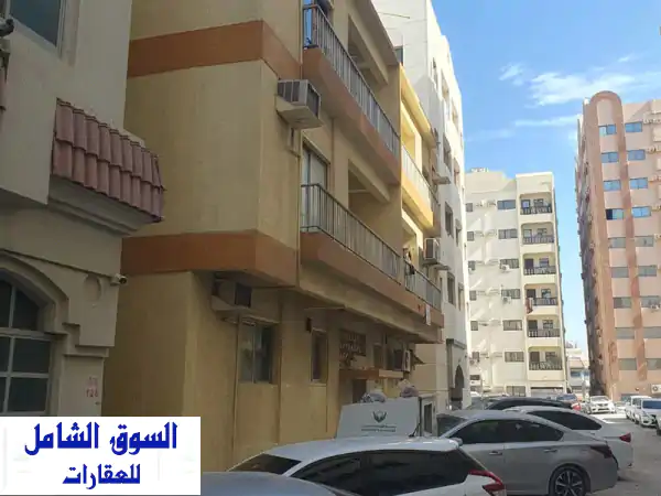 بناية تجارية مؤجرة بالكامل في البوظينة - الشارقة | فرصة استثمارية ممتازة