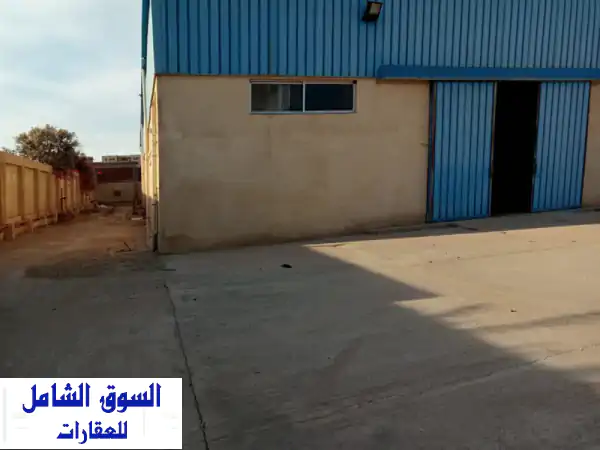 مخزن للإيجار العامرية 1300م | أمام المنطقة الحرة مباشرة...