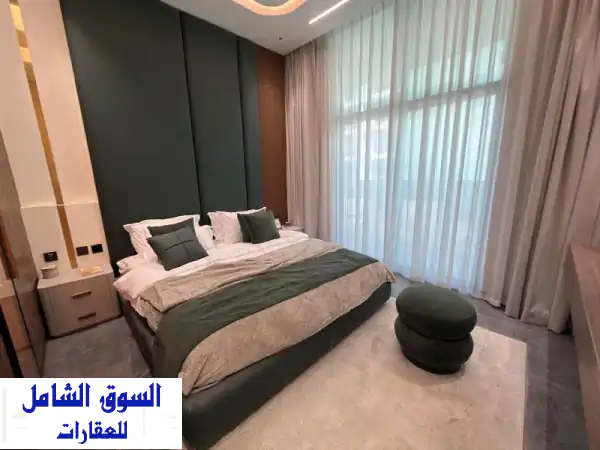 شقة أحلامك في مجان دبي: 2 نوم مفروشة بالكامل وSmart Home - تسليم 2026