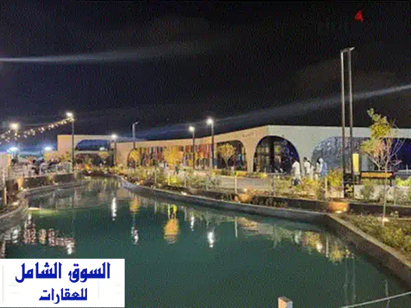 فرصة ذهبية: شاليه صف أول لاجون بمزارين العلمين الجديدة | استلام فوري | 2 غرفة | موقع استثنائي!