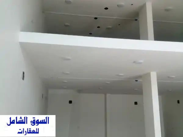 فرصة استثمارية مذهلة: معرض تجاري 100 م² للإيجار بسلماباد | موقع استراتيجي حيوي بجوار جراج المرسيدس