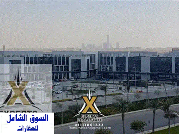 فرصة استثمار ذهبية بمدينتي: محل 50م أرضي بإيست هب | متشطب، مؤجر لبراند، استلم إيجارك فوري!