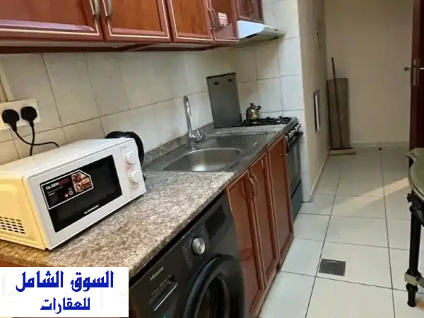 استوديو للبيع في أبراج الأورينت تاور C - الطابق 18 بإطلالة حديقة | استثمار مؤجر بعائد 22 ألف ومقدم 135 ألف فقط!
