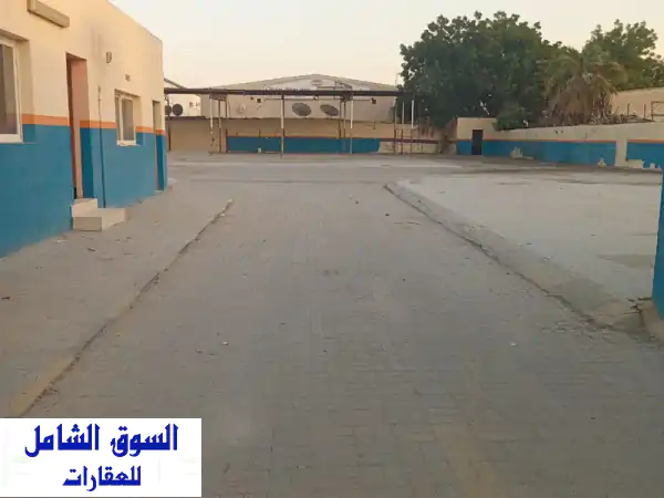 فرصة استثنائية: حوطة صناعية وتجارية ضخمة 20,000 قدم² للإيجار | موقع استراتيجي بالمنطقة الصناعية 4