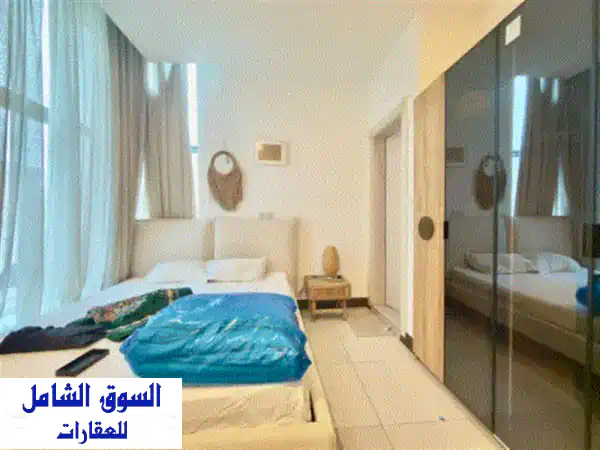 شقة مفروشة فاخرة للإيجار بالسالمية | غرفتي نوم، مسبح وجيم | موقع حيوي بقرب لولو والمدرسة الأمريكية