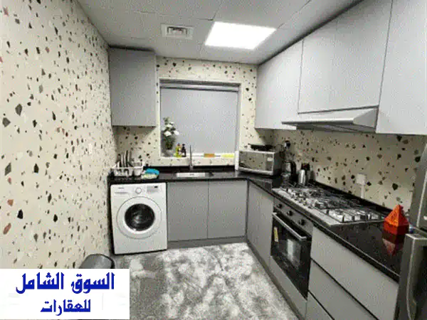 فرصة استثمارية ذهبية: شقة للبيع في أبراج اللؤلؤة عجمان، الراشدية 1 | غرفة وصالة مفروشة بالكامل بعائد 36 ألف درهم!